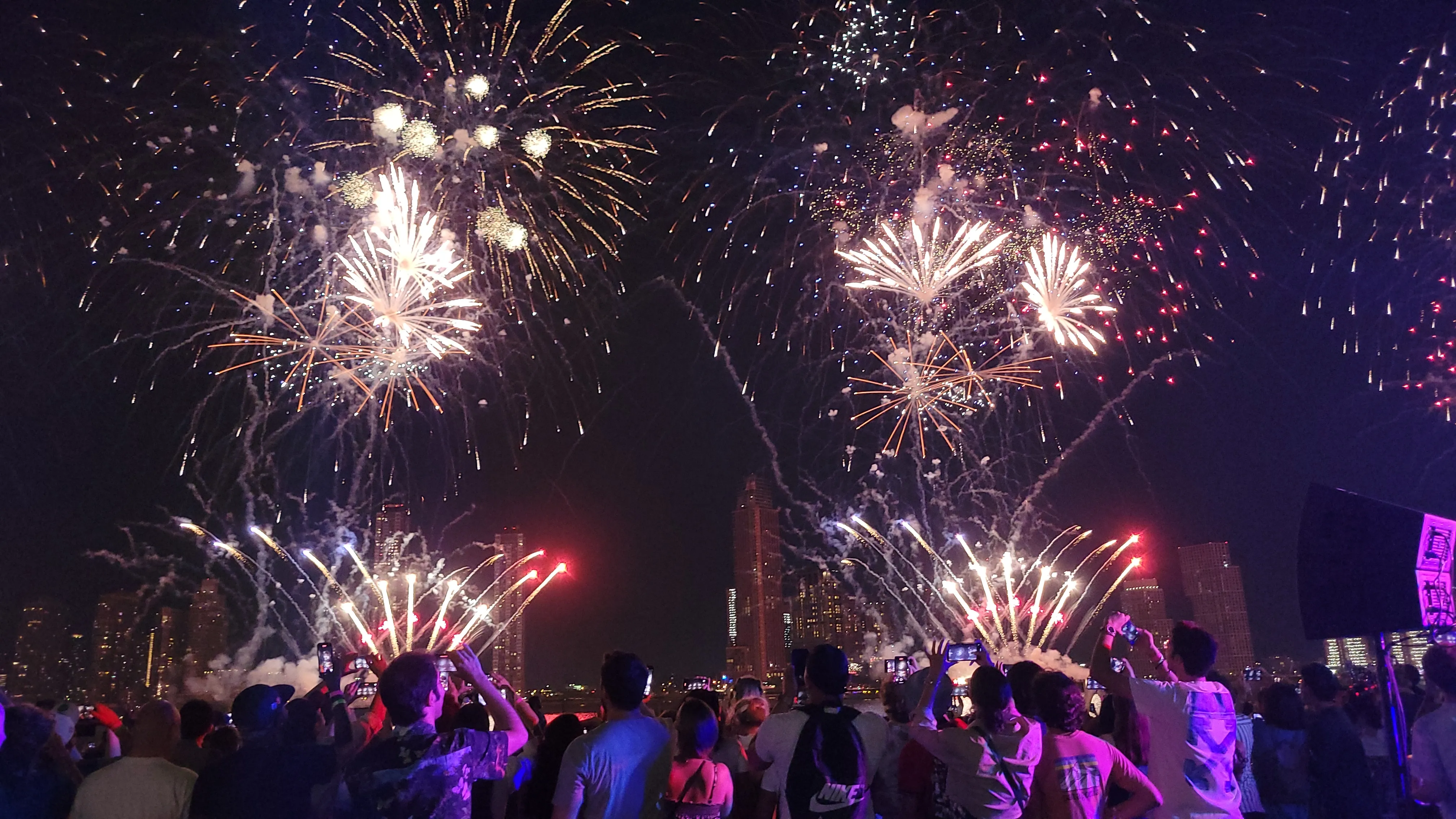 Spectacular Macy's fireworks display over East River with Manhattan skyline